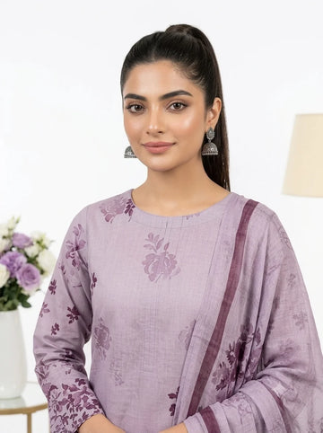 Woman wearing a purple floral outfit with a white background