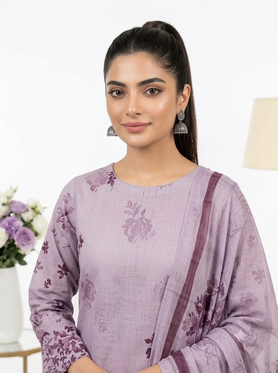 Woman wearing a purple floral outfit with a white background
