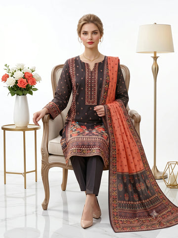 Woman sitting in a chair wearing a traditional outfit with a floral pattern, holding a matching dupatta.
