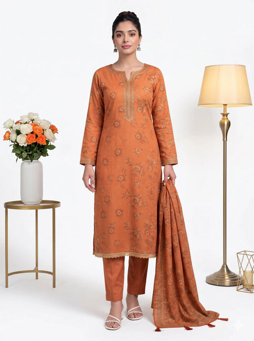Woman wearing an orange traditional outfit with a lamp and flowers in the background