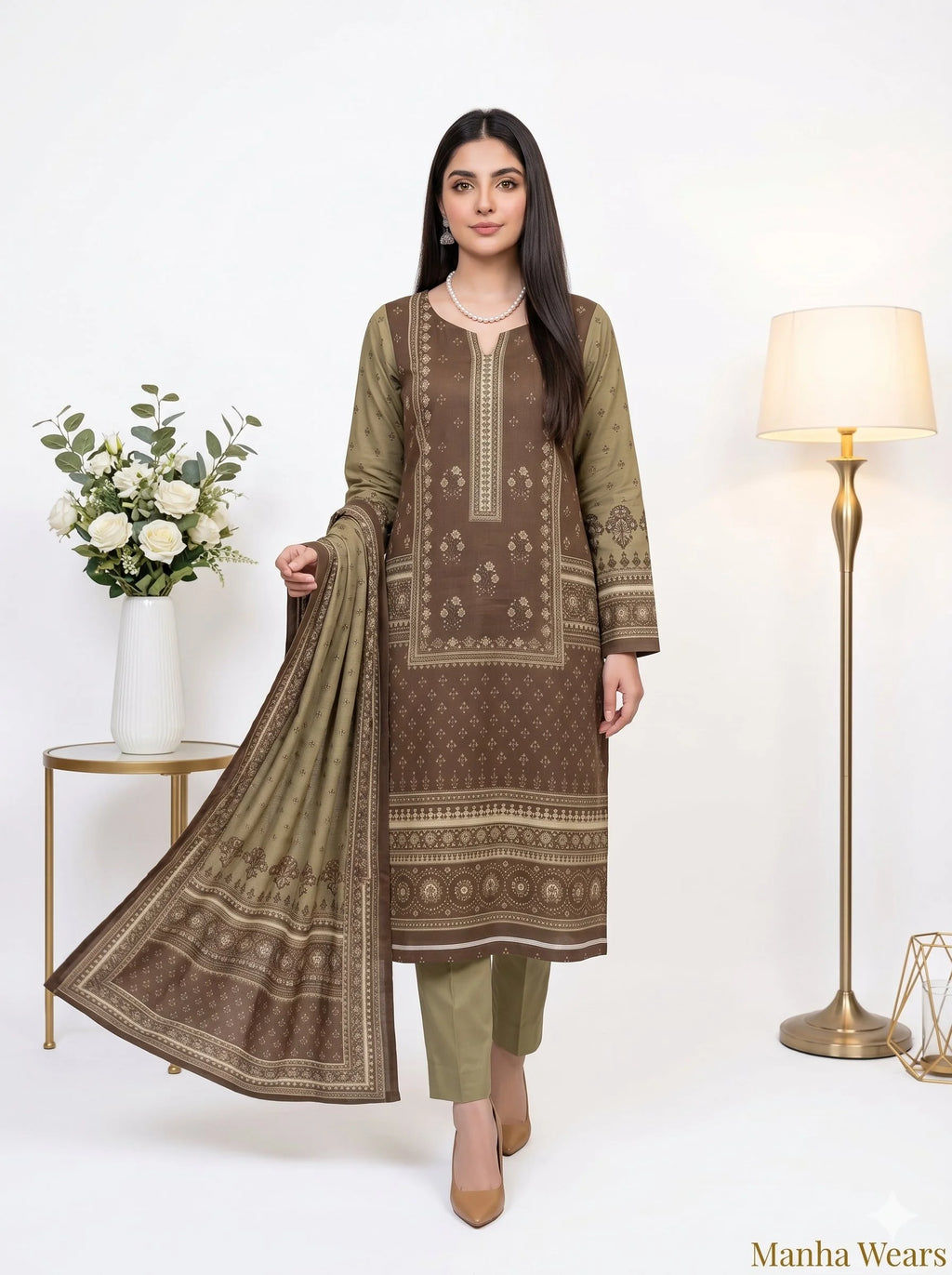 Woman wearing a brown and green traditional outfit with a matching dupatta, standing against a white background.